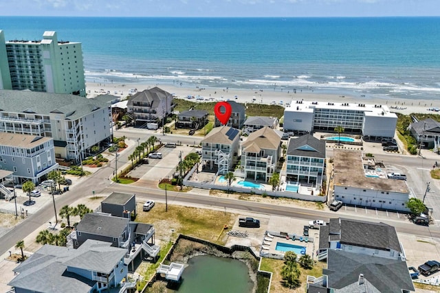 aerial view featuring a beach view and a water view