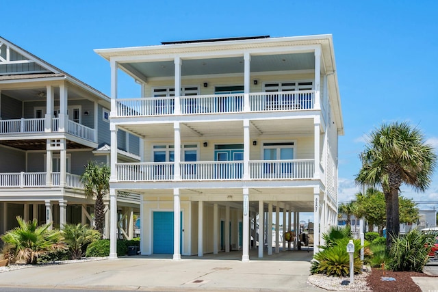 coastal inspired home featuring a carport