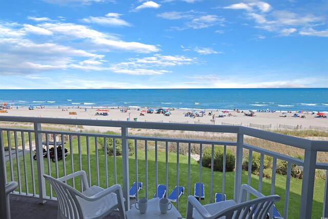 balcony with a view of the beach and a water view