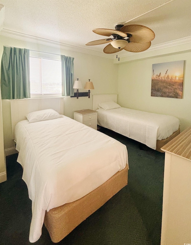 carpeted bedroom featuring a textured ceiling, crown molding, and ceiling fan