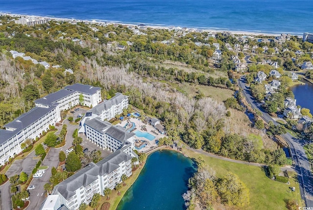 bird's eye view with a water view and a view of the beach