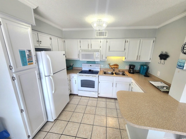 kitchen featuring white appliances, white cabinets, sink, light tile patterned flooring, and kitchen peninsula