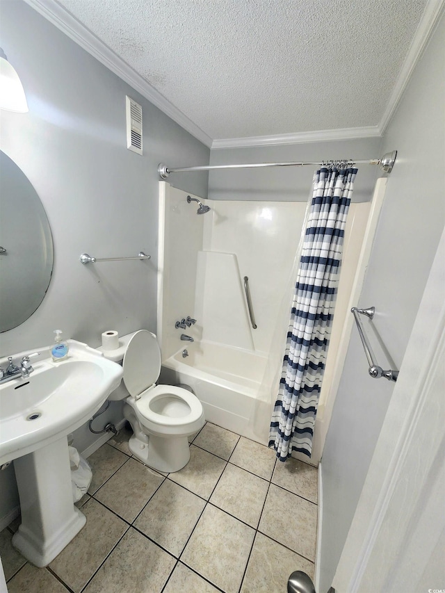 bathroom with tile patterned flooring, shower / bath combination with curtain, ornamental molding, and a textured ceiling