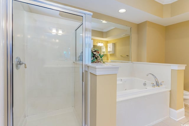 bathroom featuring tile patterned flooring, toilet, ornamental molding, and shower with separate bathtub