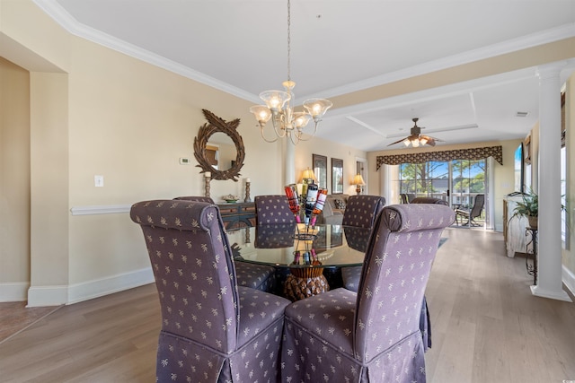 dining area with ceiling fan with notable chandelier, light wood-type flooring, and ornamental molding