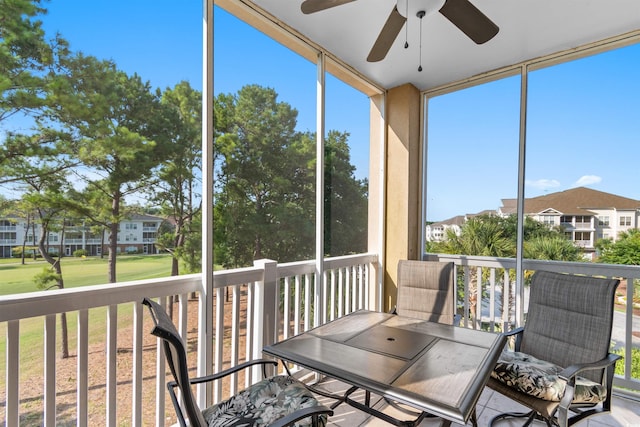 sunroom featuring a wealth of natural light and ceiling fan