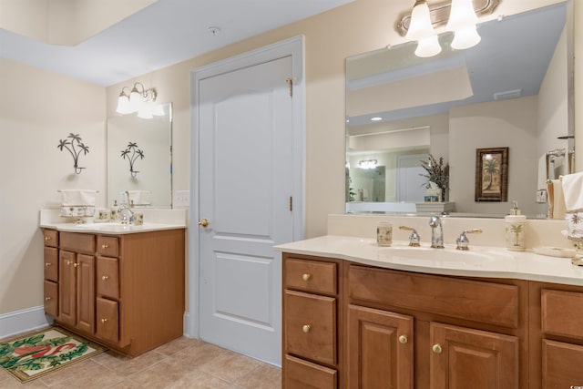 bathroom with tile patterned flooring and vanity