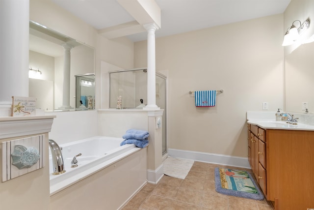 bathroom with tile patterned flooring, vanity, and shower with separate bathtub