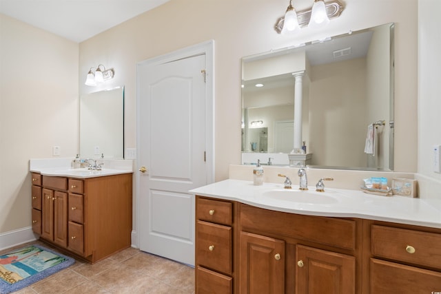 bathroom featuring tile patterned flooring and vanity