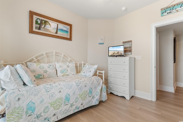 bedroom with light wood-type flooring