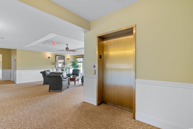 corridor with elevator and carpet floors