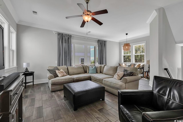 living room with ceiling fan, ornamental molding, and dark wood-type flooring