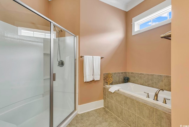 bathroom with shower with separate bathtub and tile patterned floors