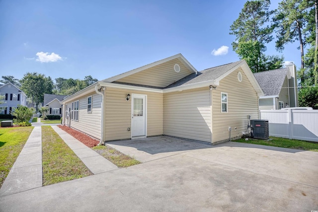 view of front of property featuring a patio and central AC