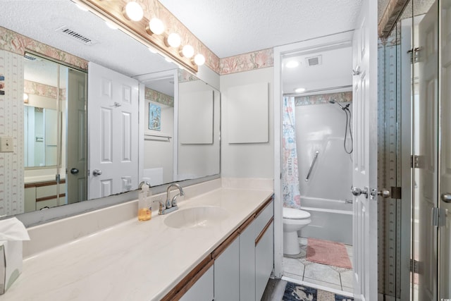 bathroom featuring visible vents, a textured ceiling, toilet, and vanity