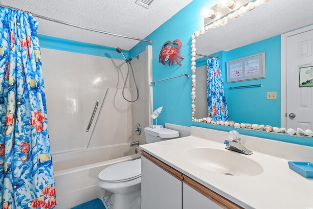 full bathroom with toilet, shower / bath combo with shower curtain, vanity, tile patterned floors, and a textured ceiling