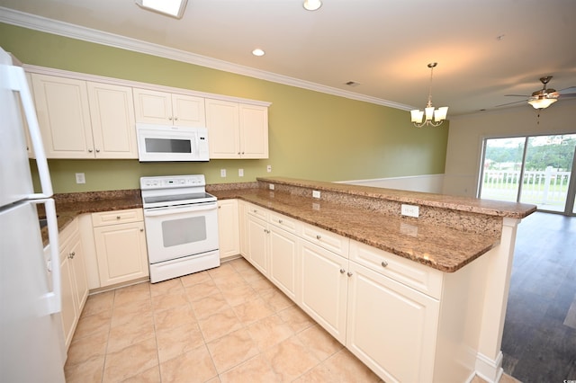 kitchen featuring hanging light fixtures, white appliances, kitchen peninsula, and white cabinets