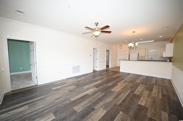 unfurnished living room featuring sink, crown molding, ceiling fan with notable chandelier, and dark hardwood / wood-style floors