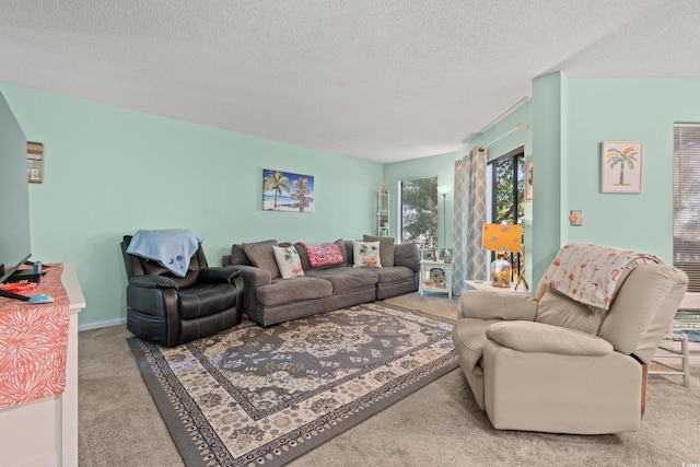 living room featuring a textured ceiling and light carpet