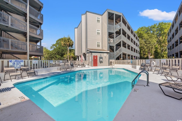 view of pool featuring a patio