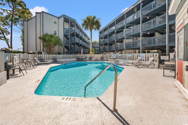 view of swimming pool featuring a patio