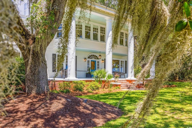 neoclassical / greek revival house with a front lawn