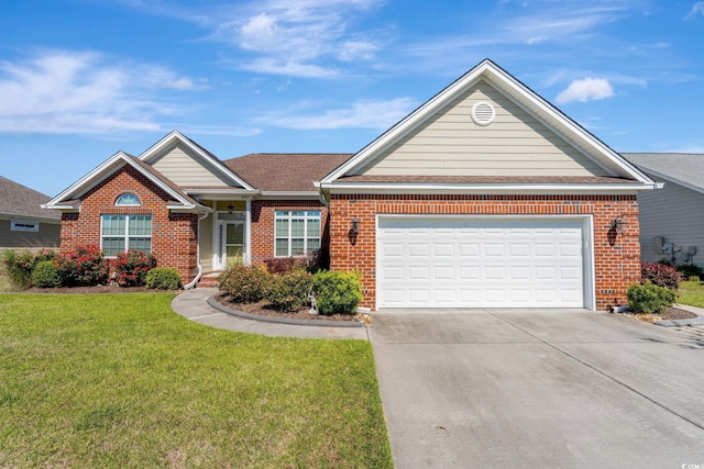 view of front of home with a front lawn and a garage