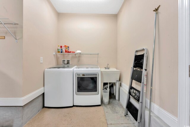 laundry room featuring washing machine and clothes dryer and washer hookup