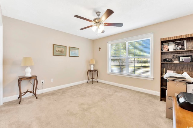 carpeted office with ceiling fan