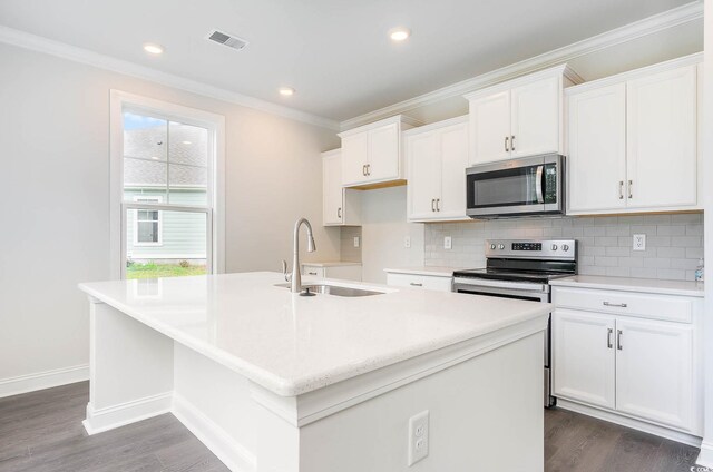 kitchen with a center island with sink, white cabinets, sink, and stainless steel appliances