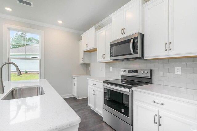 kitchen featuring white cabinetry, sink, and stainless steel appliances