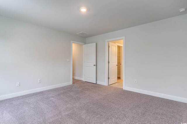 unfurnished bedroom with light carpet