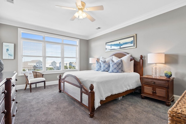 carpeted bedroom with ceiling fan and crown molding