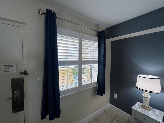 entryway featuring light tile patterned floors