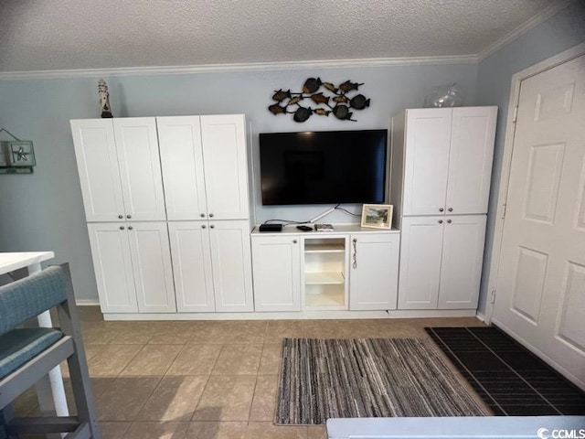 107 Toby Ct Unit 103-A, North Myrtle Beach, SC 29582 - living area with a textured ceiling, crown molding, and light tile patterned floors