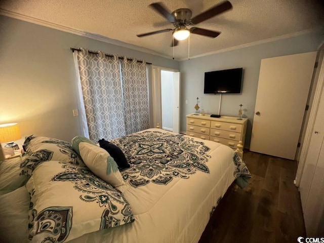 bedroom featuring ornamental molding, dark wood-type flooring, a textured ceiling, and ceiling fan