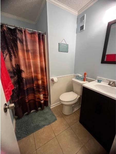 bathroom featuring vanity, toilet, ornamental molding, a textured ceiling, and tile patterned flooring