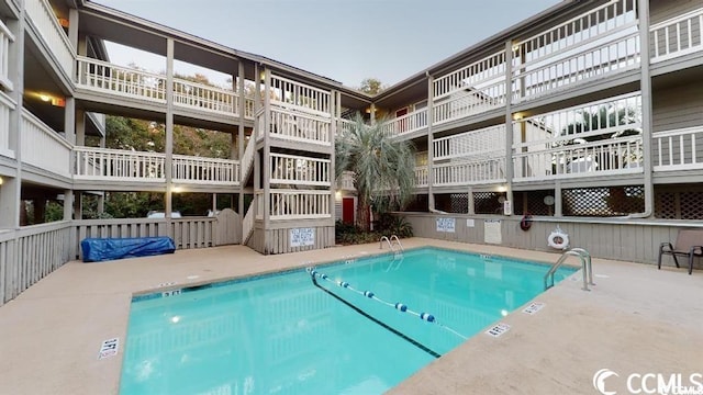 view of pool featuring a patio area