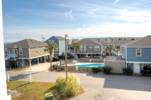 view of pool with a water slide and a patio