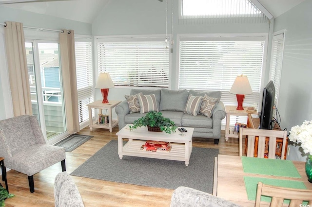 sunroom / solarium featuring lofted ceiling