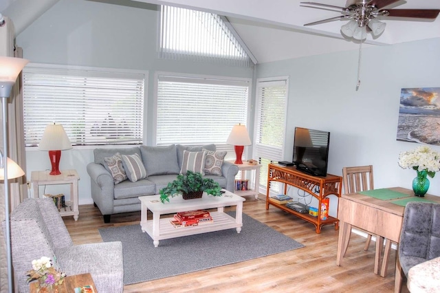 living room featuring ceiling fan, a wealth of natural light, and hardwood / wood-style floors