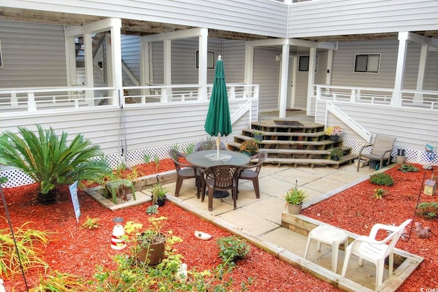 entrance to property with a patio