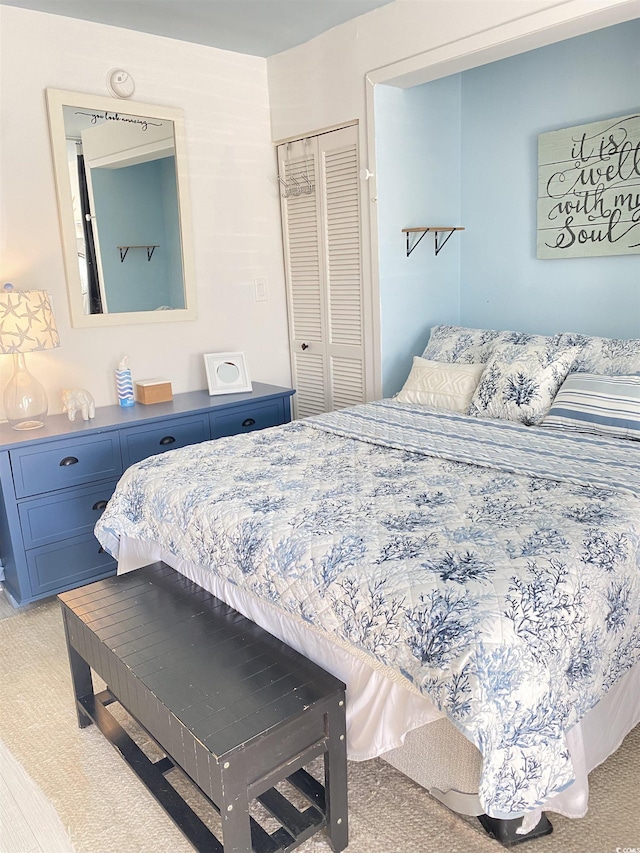 bedroom with carpet floors and a closet