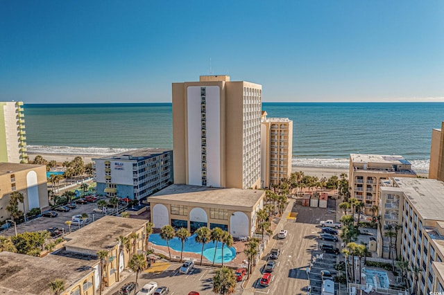 drone / aerial view with a water view and a view of the beach