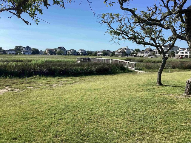 118 Salt Marsh Cir Unit 25B, Pawleys Island, SC 29585 - view of green lawn with a residential view