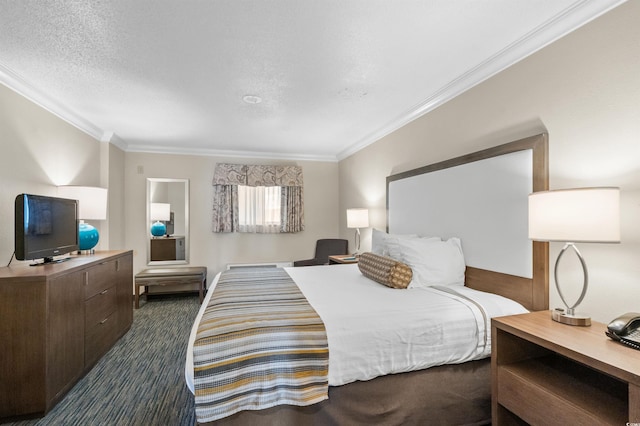 carpeted bedroom with ornamental molding and a textured ceiling