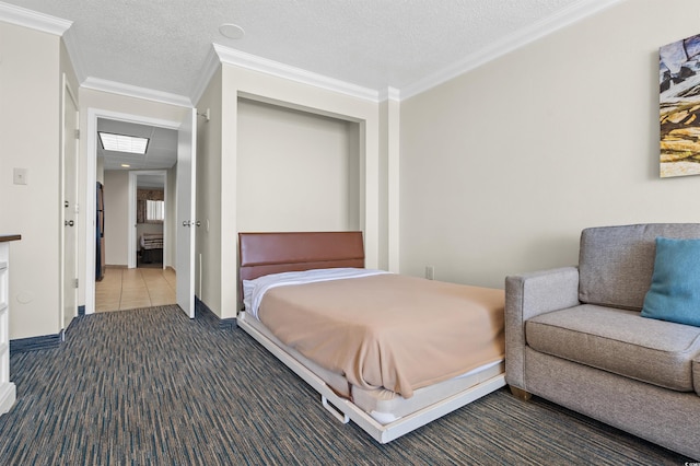 bedroom featuring ornamental molding, dark colored carpet, and a textured ceiling