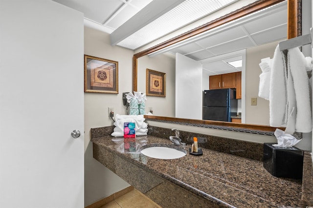 bathroom featuring tile patterned floors and vanity