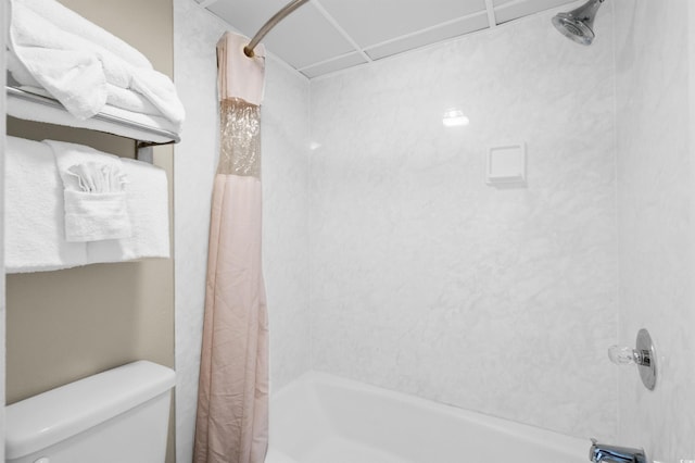 full bathroom with shower / bath combo with shower curtain and toilet