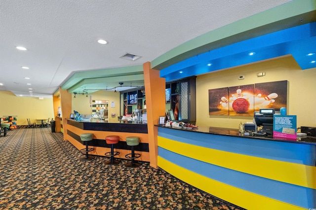 reception area with a bar and visible vents